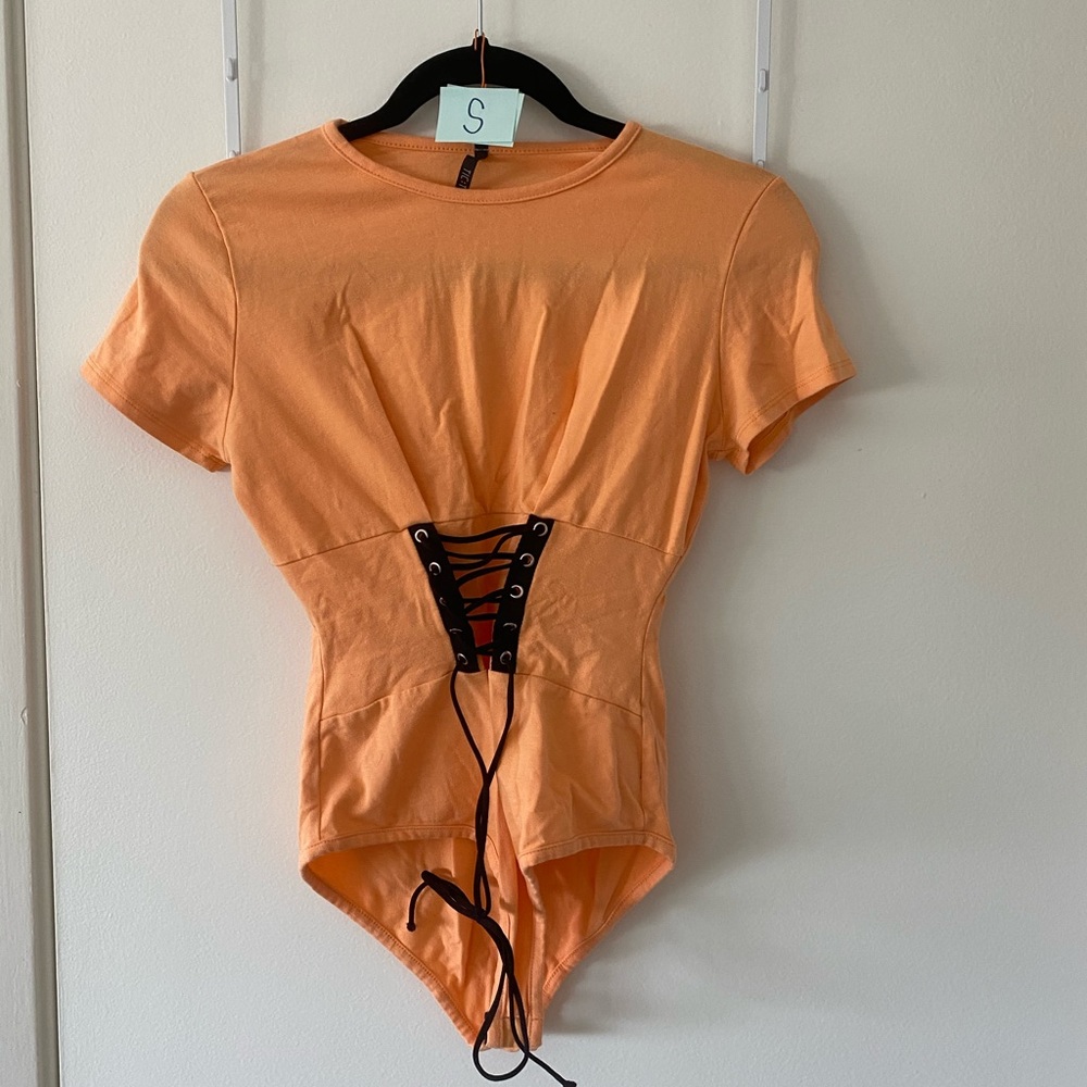 Orange tie body suit